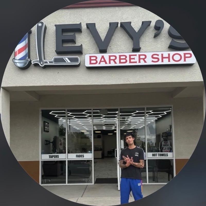 Hector, known as Trimmy Changa, outside Levy’s Barber Shop.